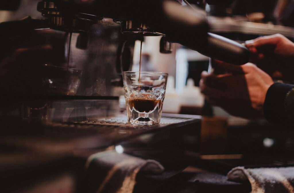espresso machine pouring espresso into glass