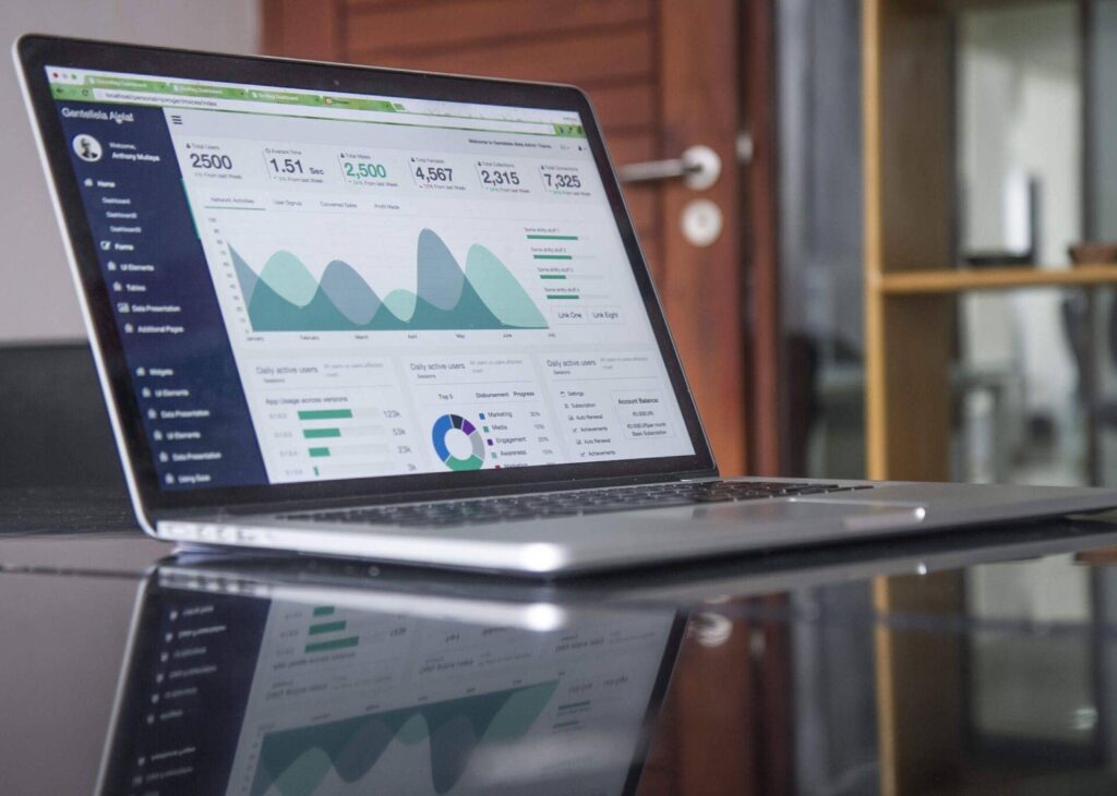 Laptop displaying monitoring charts and data