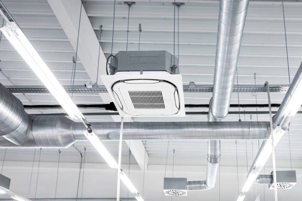 Ceiling-mounted air-conditioning unit and ventilation ducts
